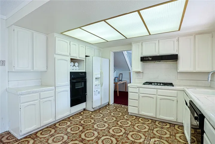 Kitchen connects formal dining room