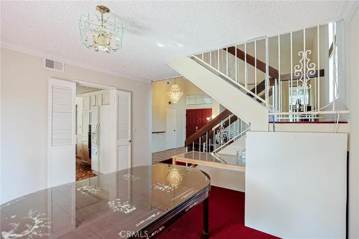 Formal dining room to main double door.
