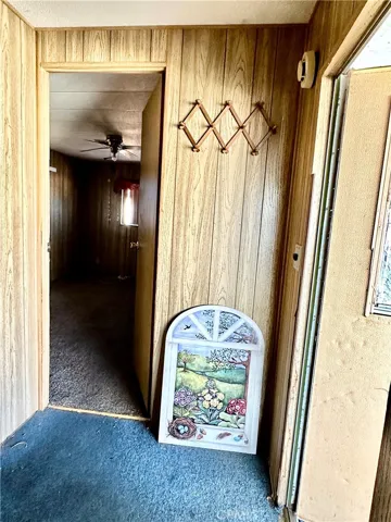 Hallway to Bedroom, right corner is backdoor