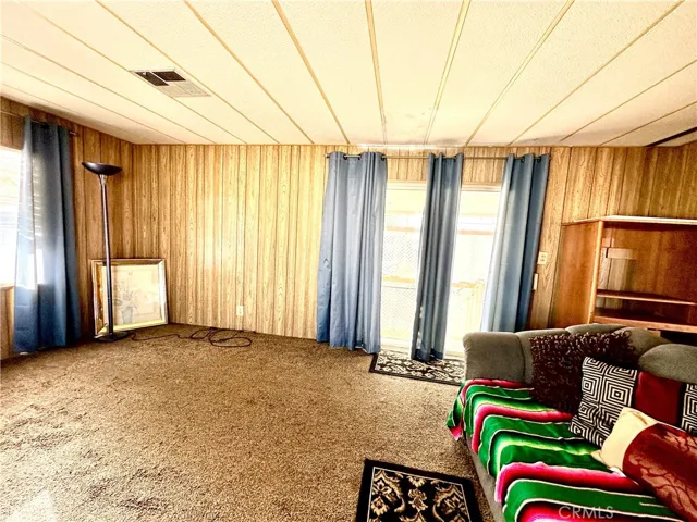 Living room view of right corner and door to patio