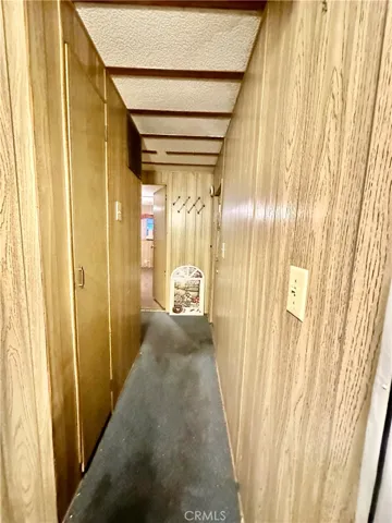 Hallway to back door and Primary Bedroom