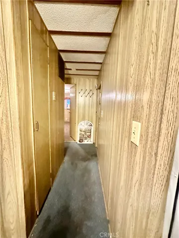 Hallway to back door and Primary Bedroom