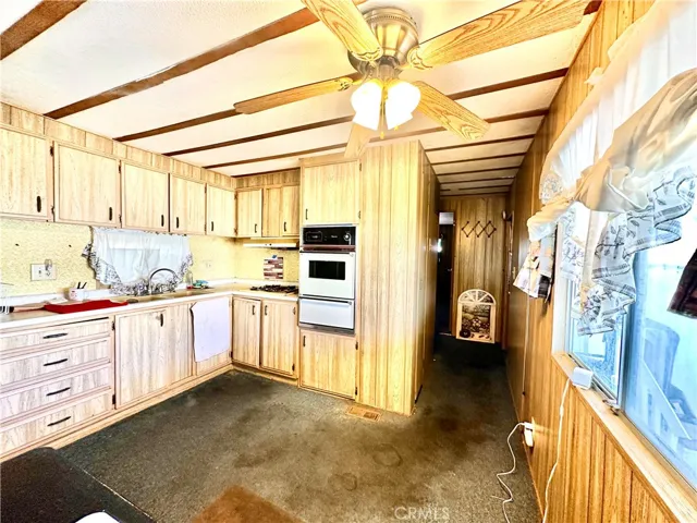 Kitchen, dining and hallway towards bedroom
