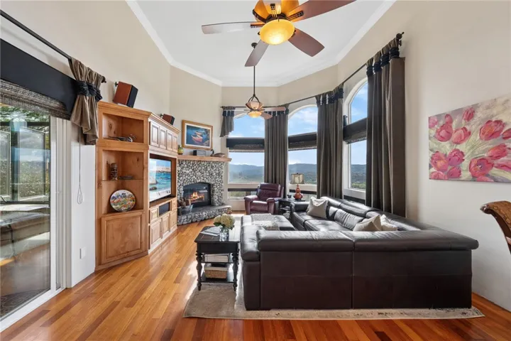 Family room with stone wood burning fireplace