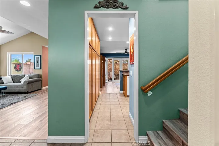 Walk in the front door and move towards the kitchen