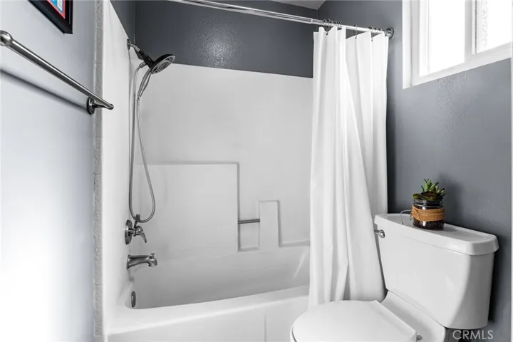 Upstairs hall bathroom with tub and shower