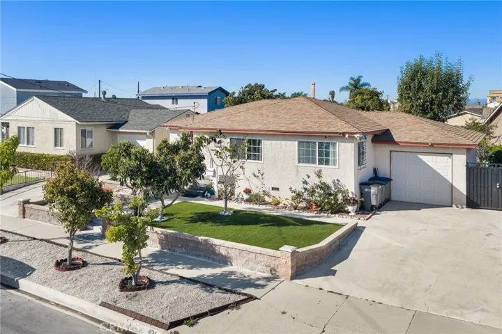 Landscaped Front Yard with charming curb appeal.