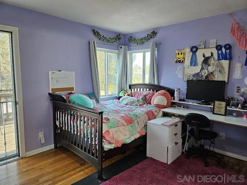 This third bedroom (w/ it's own half-bath & a walk-in closet) also leads directly to the expansive backyard deck w/ canyon views.