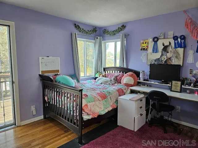 This third bedroom (w/ it's own half-bath & a walk-in closet) also leads directly to the expansive backyard deck w/ canyon views.