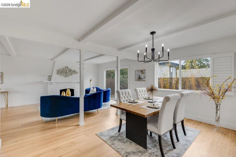 Bright interior featuring wood-finish flooring throughout