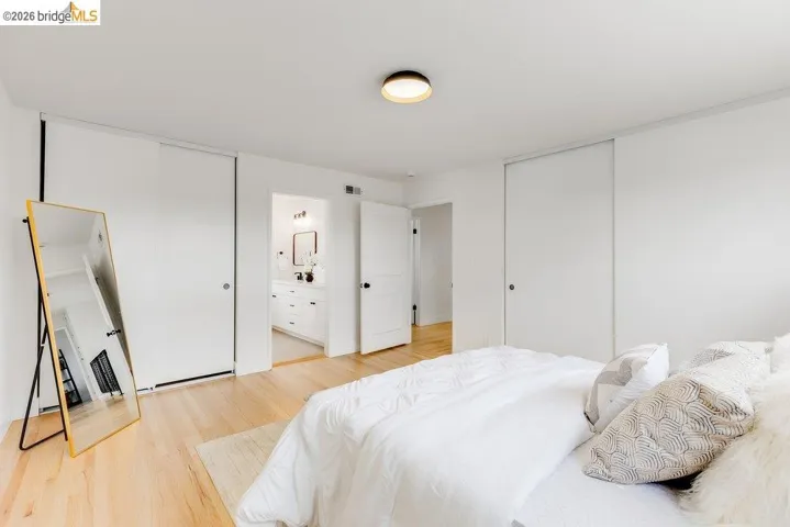 Light wood-finish flooring complements white walls