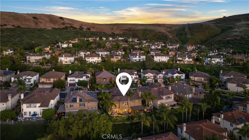 Ideally situated within the gated community of San Juan Hills Estates, surrounded by rolling hills and picturesque neighborhood views