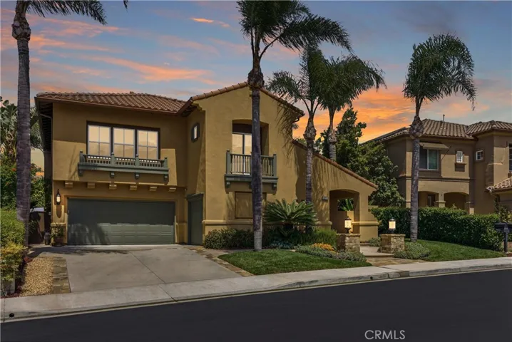 Elegant exterior with manicured landscaping and inviting curb appeal set along a quiet interior street