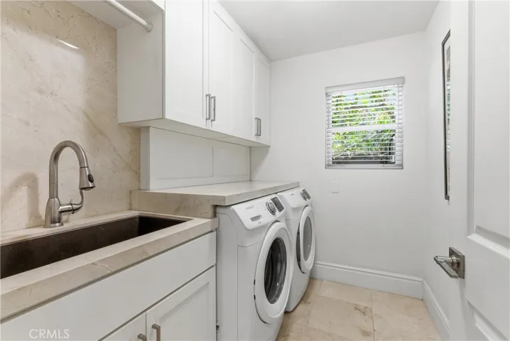 Spacious laundry room with sink