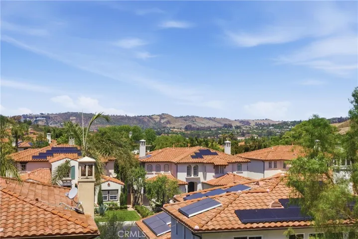 Elevated hillside and neighborhood views add to the home’s serene setting