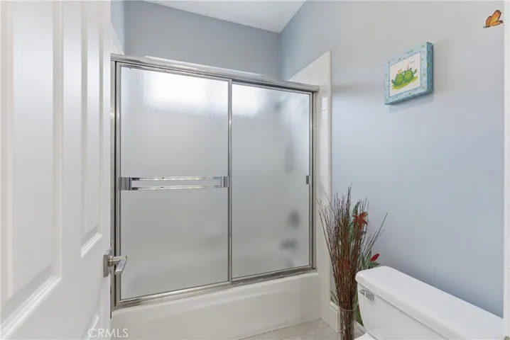 Secondary bathroom with dual vanities, spacious countertops, and functional access connecting the adjoining bedrooms