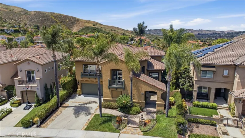 Elegant exterior with manicured landscaping and inviting curb appeal set along a quiet interior street