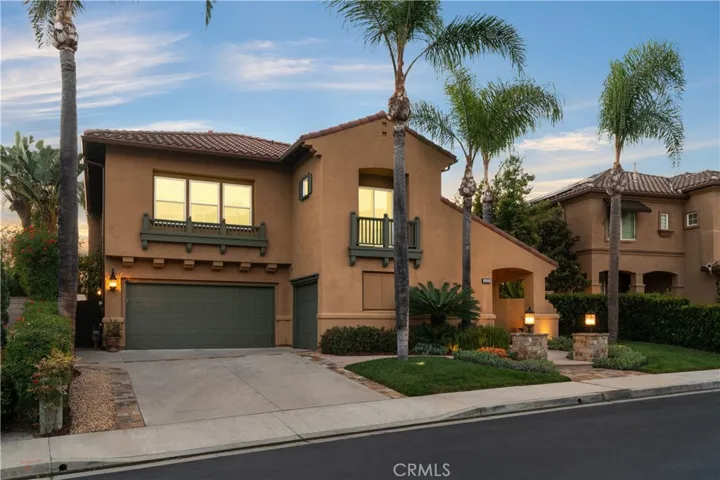Elegant exterior with manicured landscaping and inviting curb appeal set along a quiet interior street