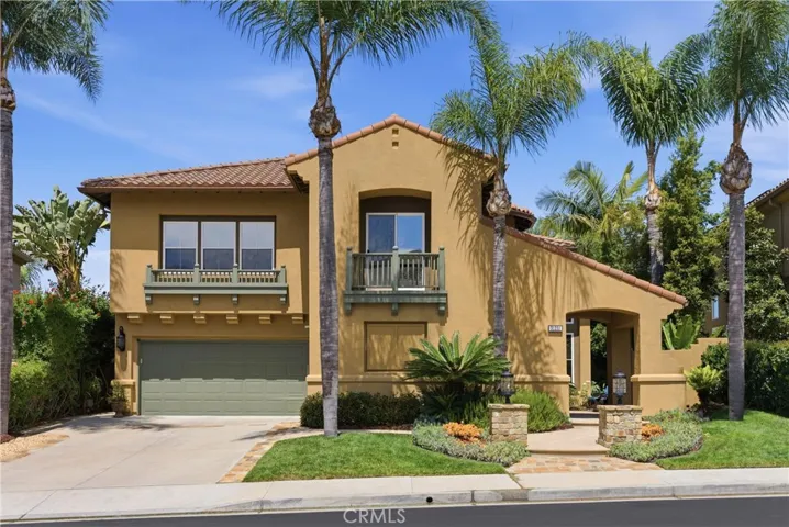 Elegant exterior with manicured landscaping and inviting curb appeal set along a quiet interior street