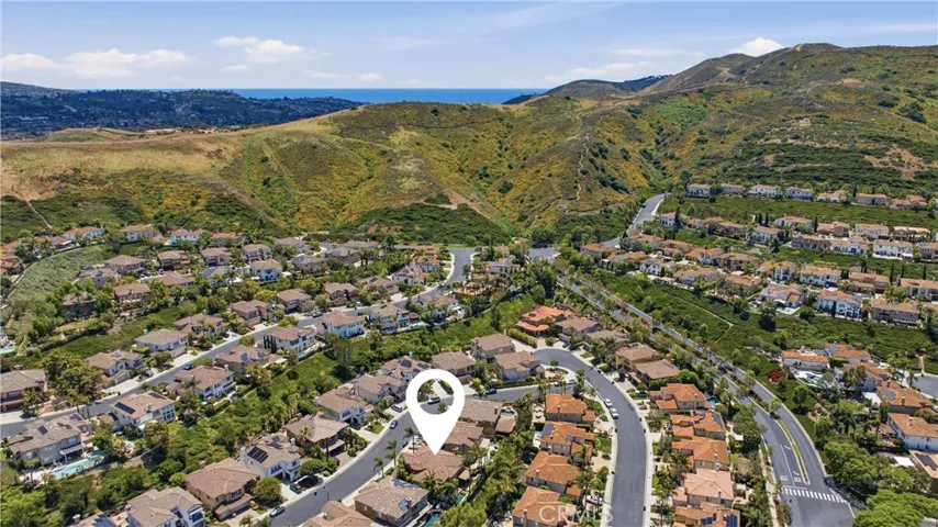Ideally situated within the gated community of San Juan Hills Estates, surrounded by rolling hills and picturesque neighborhood views