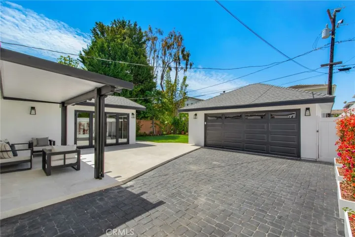 Driveway leading to detached two-car garage | 305 Robinhood Ln., Eastside Costa Mesa 92627