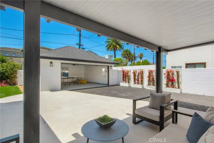 Covered patio tailored for entertaining | 305 Robinhood Ln., Eastside Costa Mesa 92627