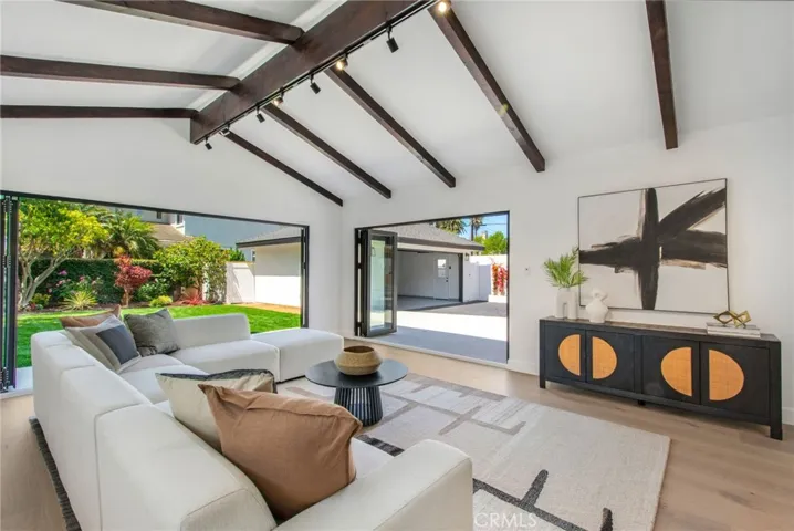 Great room with restored exposed timber beams and vaulted ceilings | 305 Robinhood Ln., Eastside Costa Mesa 92627