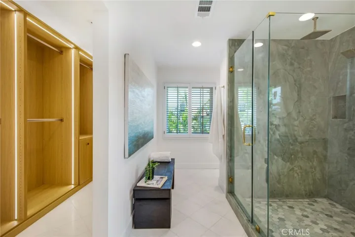 Primary bath layout with walk-in closet and frameless glass shower | 305 Robinhood Ln., Eastside Costa Mesa 92627