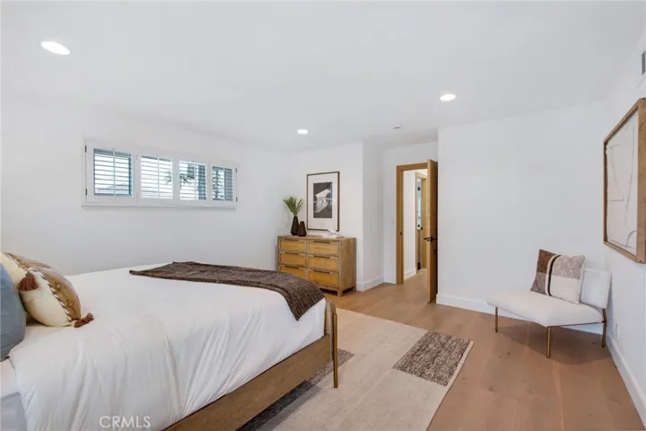 Primary bedroom suite with European white oak floors | 305 Robinhood Ln., Eastside Costa Mesa 92627