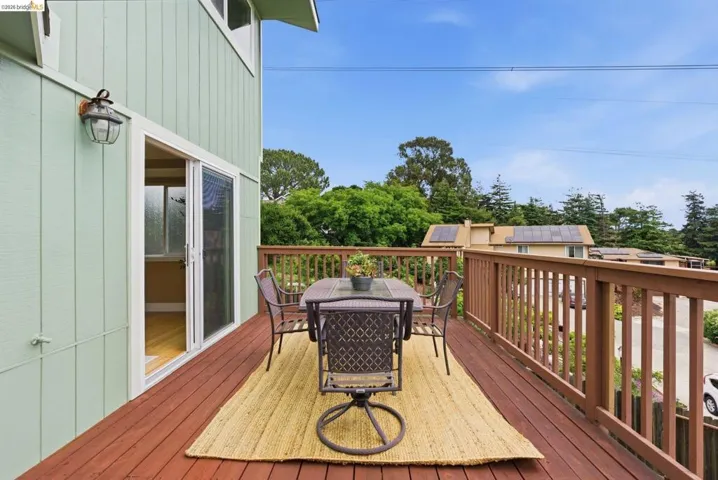 Spacious wood deck with a stained finish and wood railing