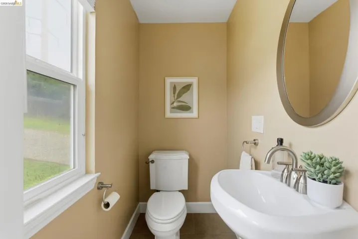 Pedestal sink with brushed nickel faucet