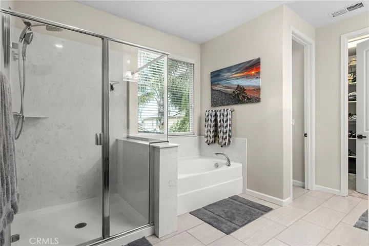 Primary bath with large shower and soaking tub
