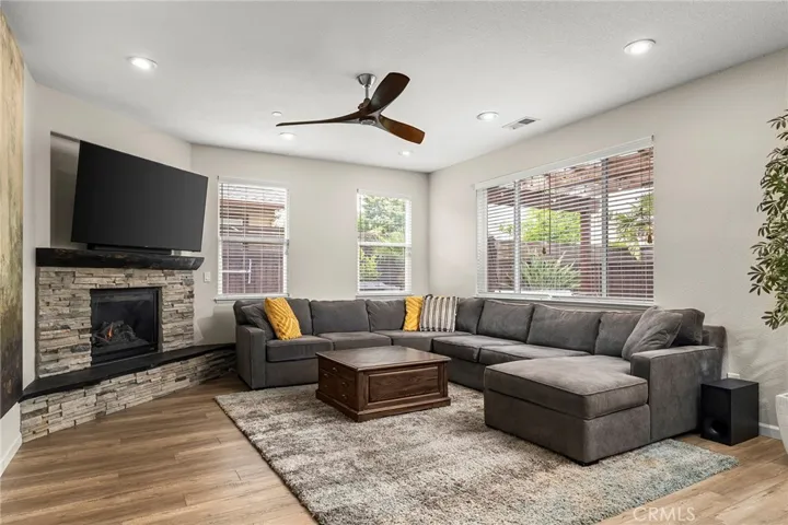 Large, cozy family room with custom hearth and mantle