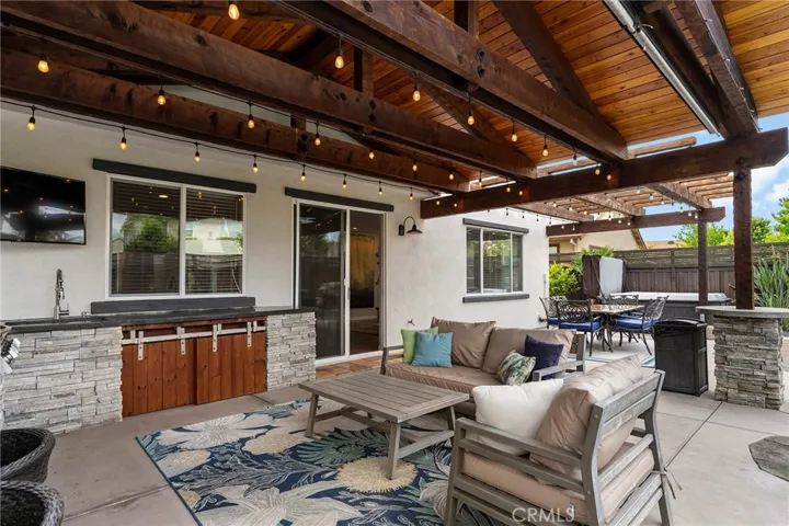 Lighting throughout the outdoor patio and pergola.