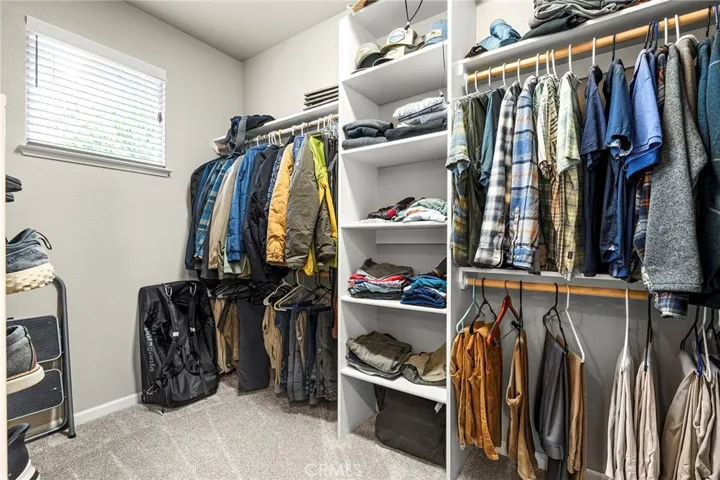 Huge walk-in closet with custom organizers