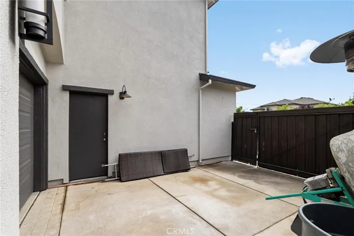 Large fenced area in front of the 3rd car garage.  Huge swinging gate allows you to have easy access