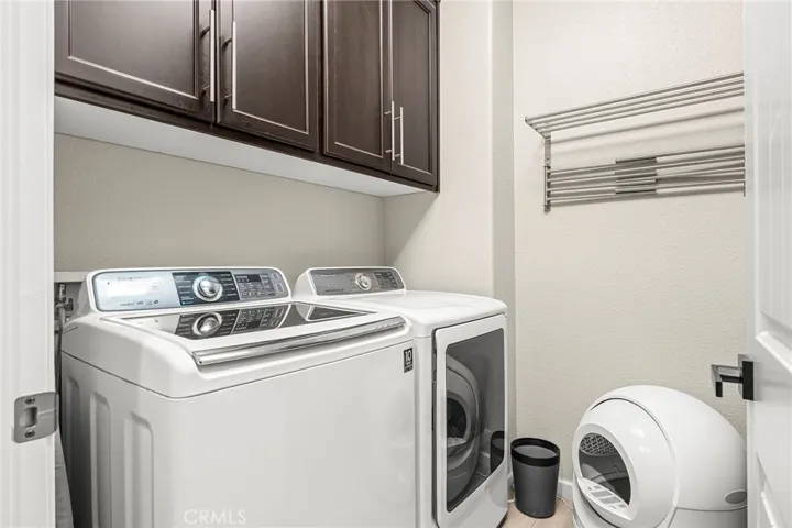 Large laundry room with tons of cabinets and folding space