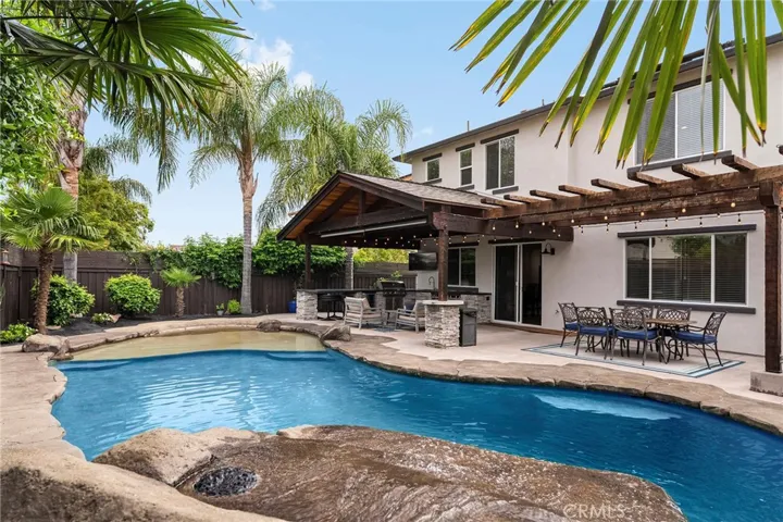 Gorgeous saltwater pool with waterfall and large outdoor resort area