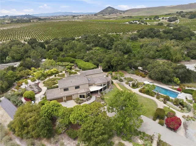 A gracious estate with expansive views of the ocean, cultivated fields, and mountains.