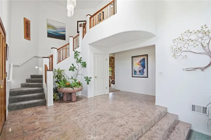 Welcoming foyer invites you you to the lovely home