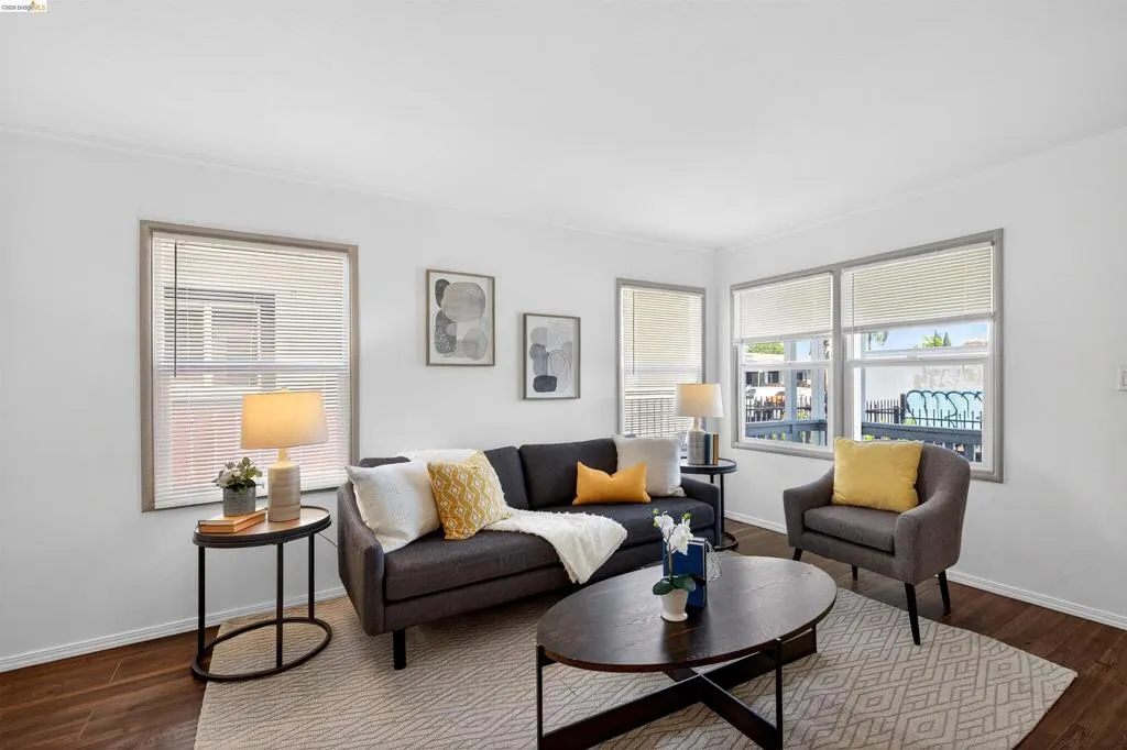 Living area featuring wood-finish flooring and white walls