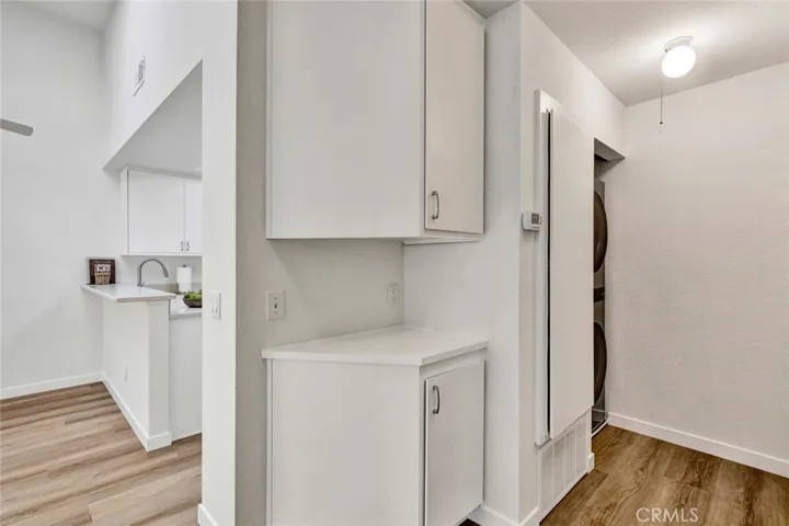 Inside laundry closet with washer and dryer included