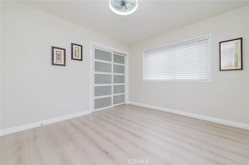 Room 2 (downstairs)- Frosted glass, white MDF wood sliding closet doors, laminated wood floorings with new baseboards