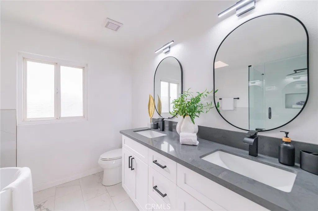 Primary Bath (3rd Bath)- dual sink vanity, SKYLIGHT, quiet exhaust fan/light, quality medicine cabinet and mirrors