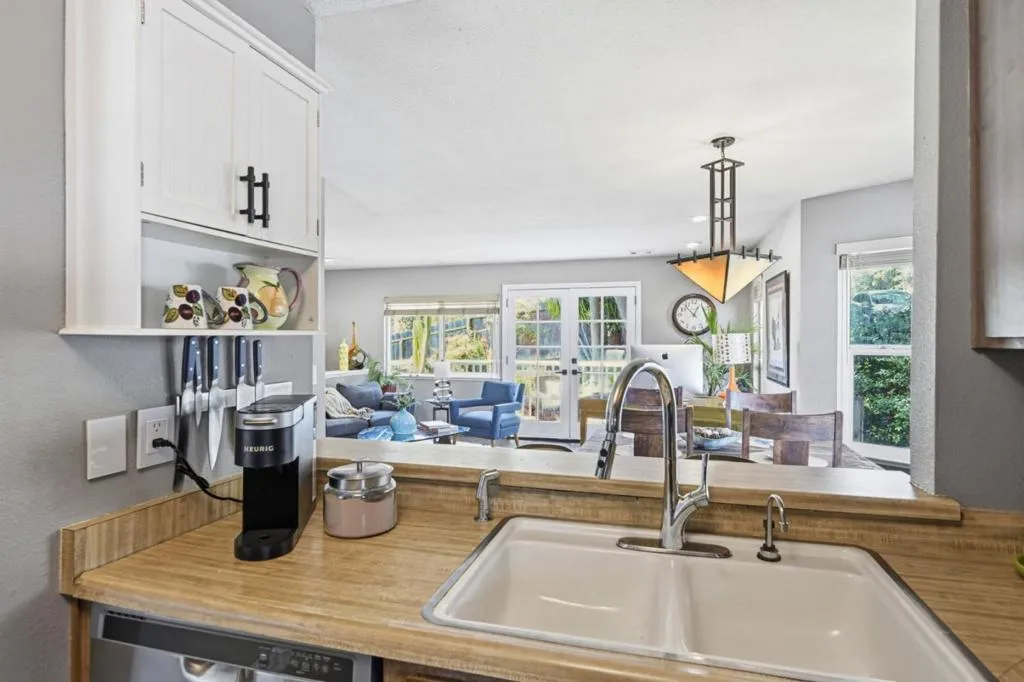 View of Dining/Livingroom area from Kitchen with countertop. View of Dining/Livingroom area from Kitchen with countertop.