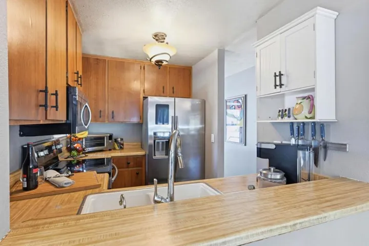 View of countertop and kitchen from dining area.