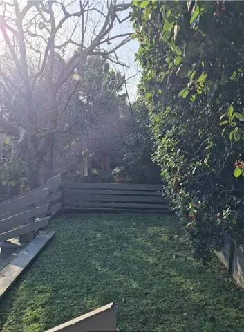 Additional grassy area in Tot Lot. Great for relaxing or private picnics.