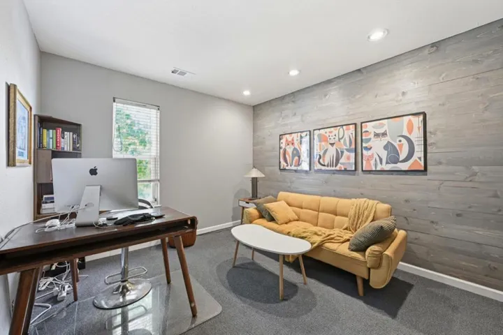 First bedroom on top floor, being used as an office.