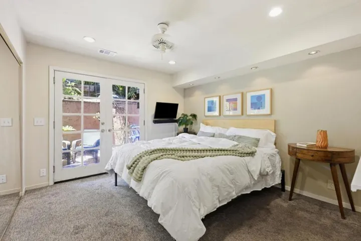 Main bedroom with French doors to private patio.