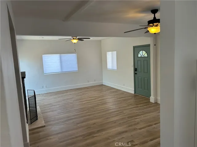 Main living area with new flooring.
